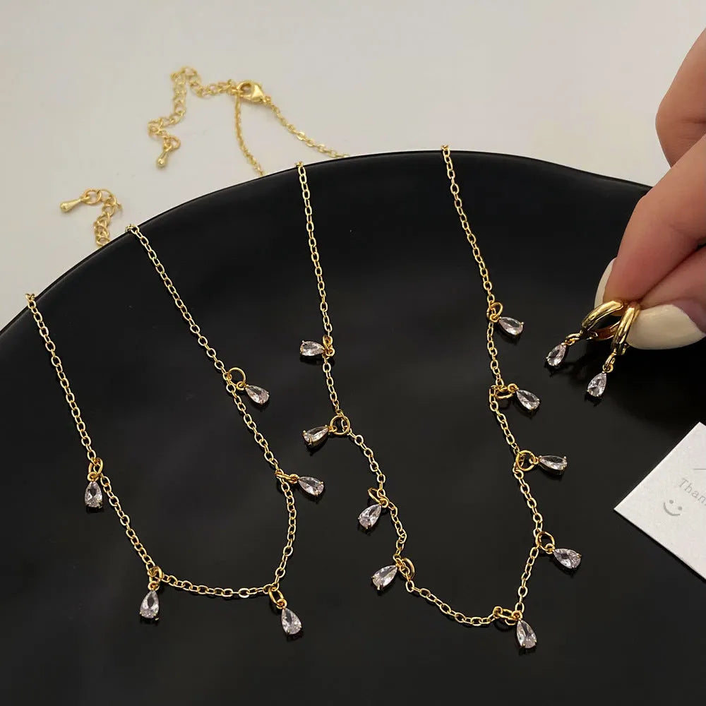 Women's zircon jewellery set with geometric necklace, earrings and anklet in meteor shower design