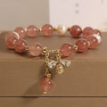 Women's freshwater pearl and strawberry quartz bracelet with zircon details on alloy chain