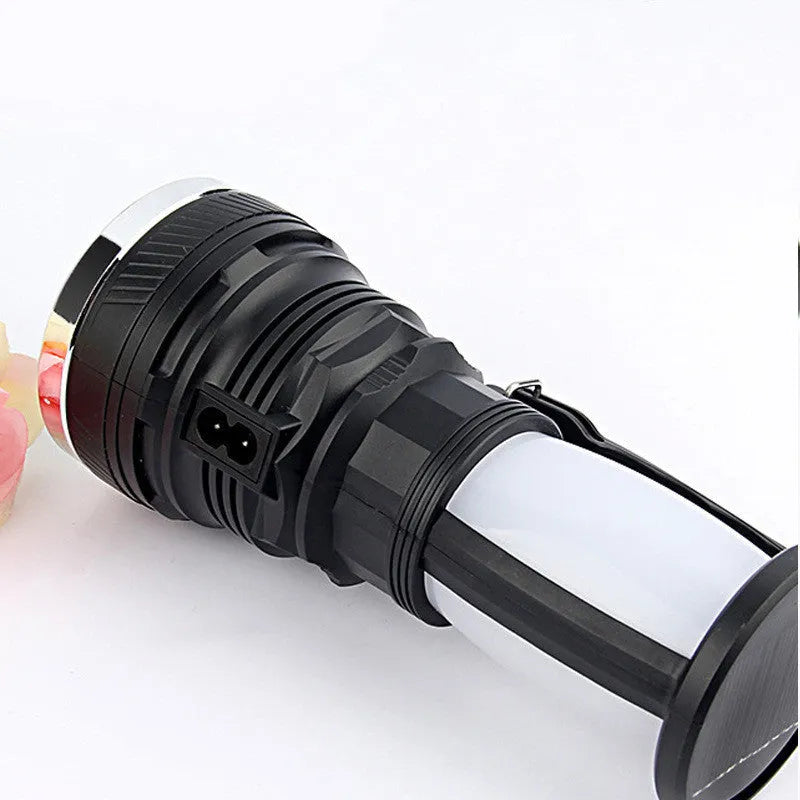 Black solar-powered LED flashlight with USB charging port on a durable ABS plastic body.