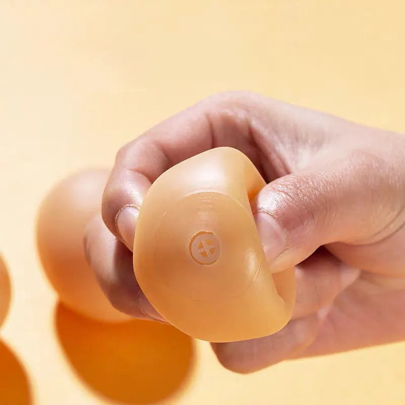 Egg-shaped plastic dog toy with squeaker for teeth cleaning and interactive play