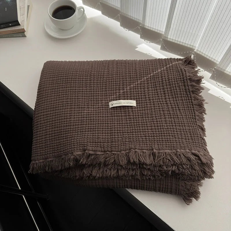 Four-layer gauze cotton blanket with tassel detailing in avocado green colour