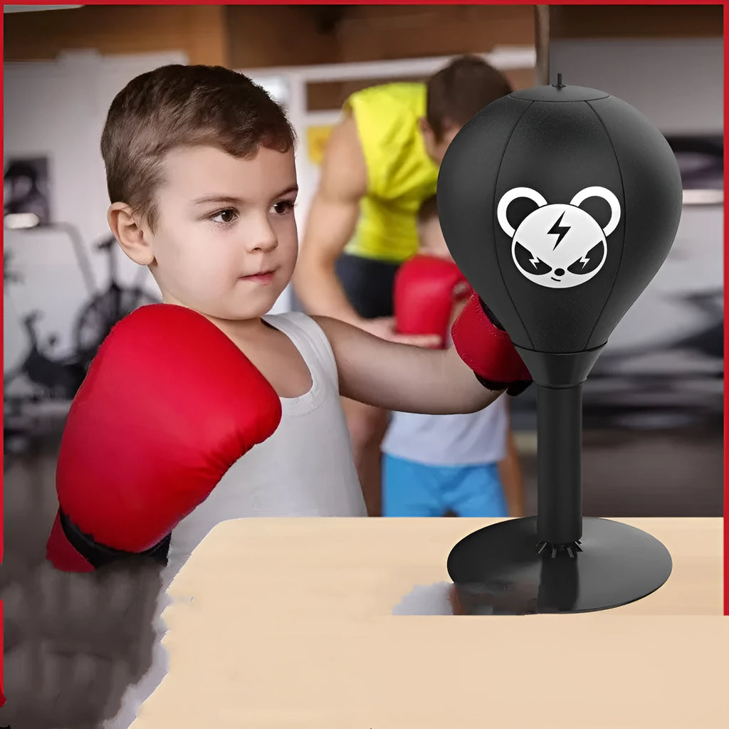 Tabletop boxing speed ball with suction cup base and inflatable PU leather sphere on a desk.