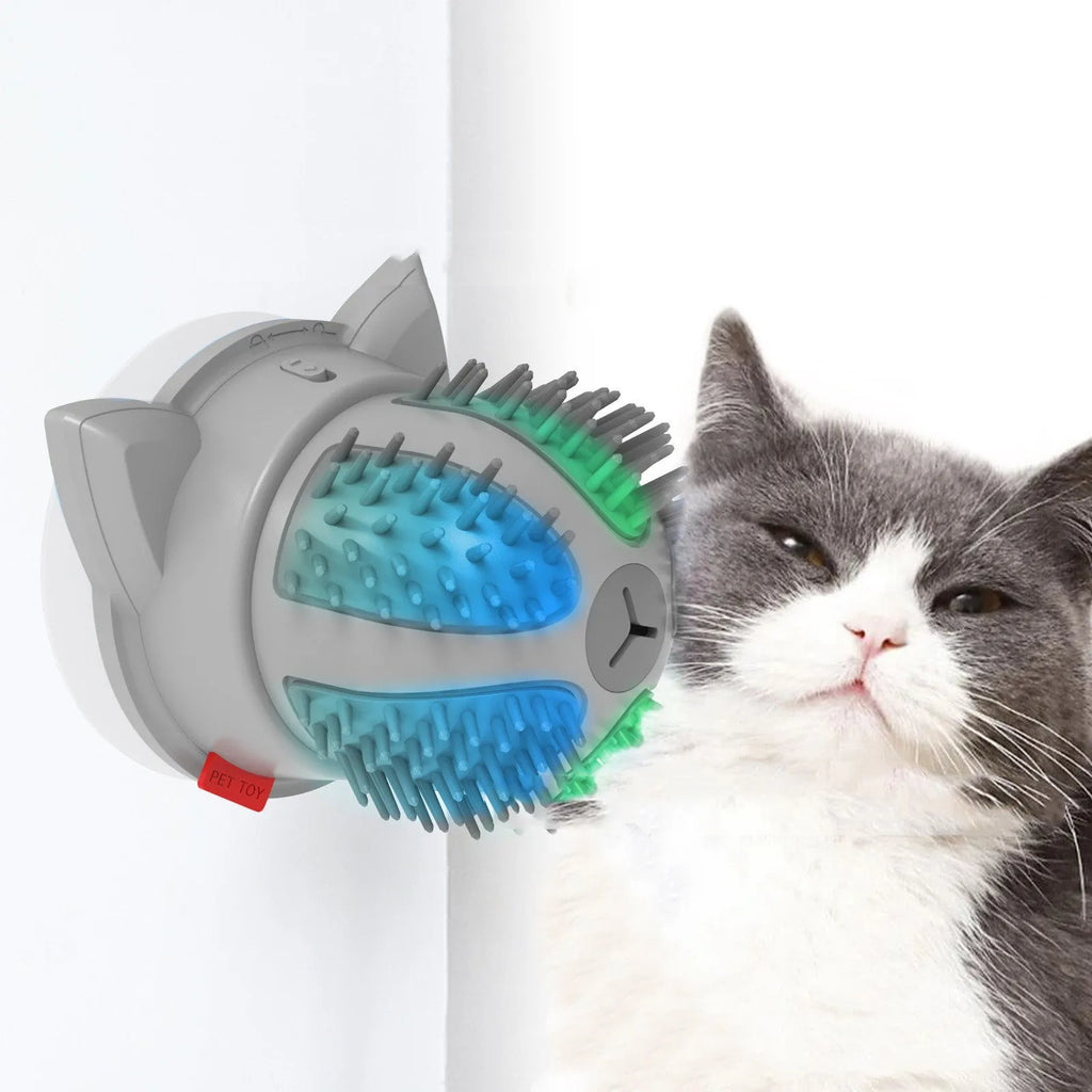 Electric Pets plastic cat brush toy with LED light and massage function on a surface