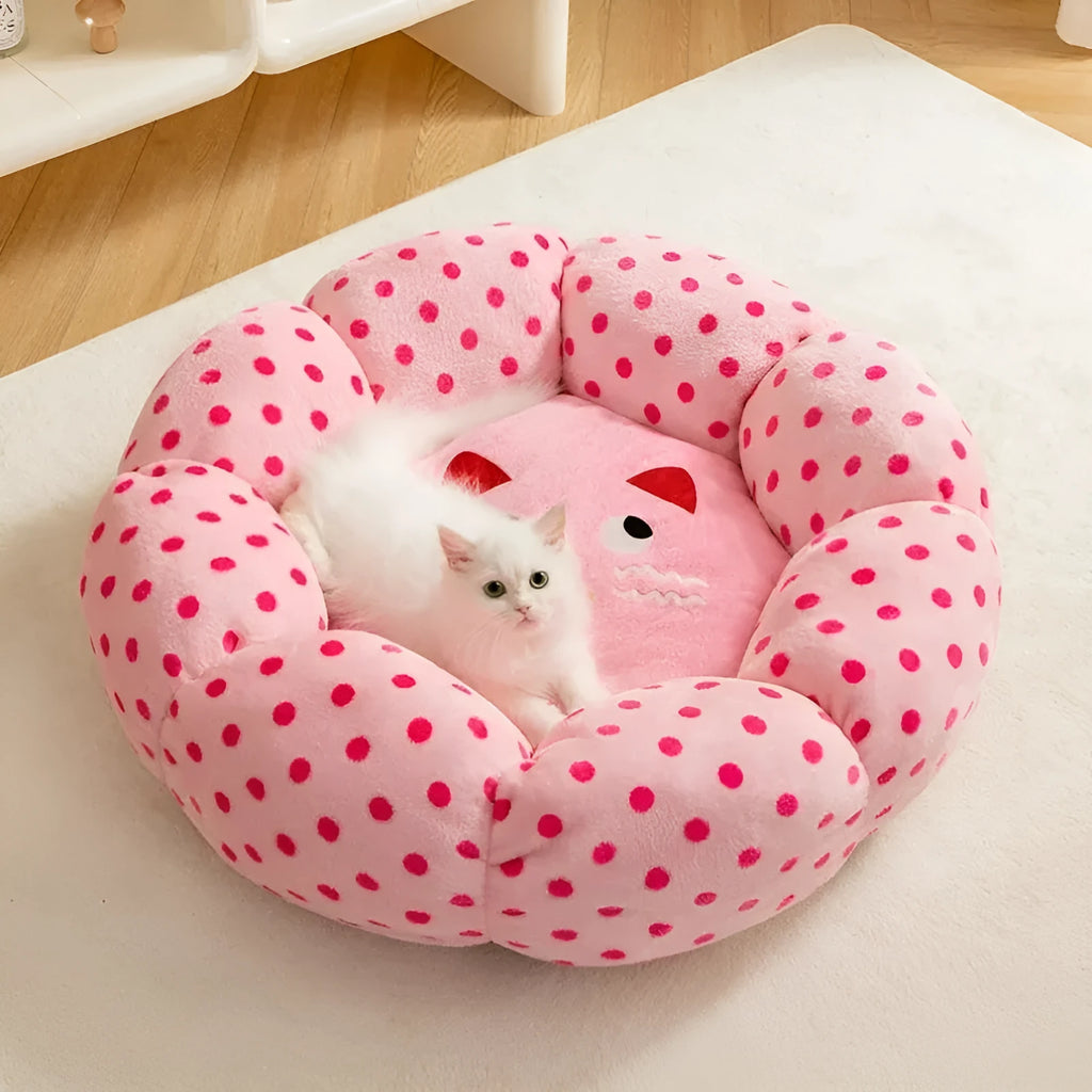 Pink dot patterned fabric cat bed shown in two sizes: 45cm and 65cm diameter.