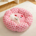 Pink dot patterned fabric cat bed shown in two sizes: 45cm and 65cm diameter.