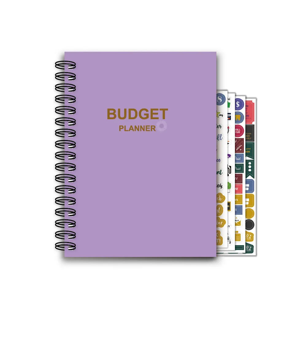 Purple A6 coil-bound budget notebook with pen and financial planning accessories