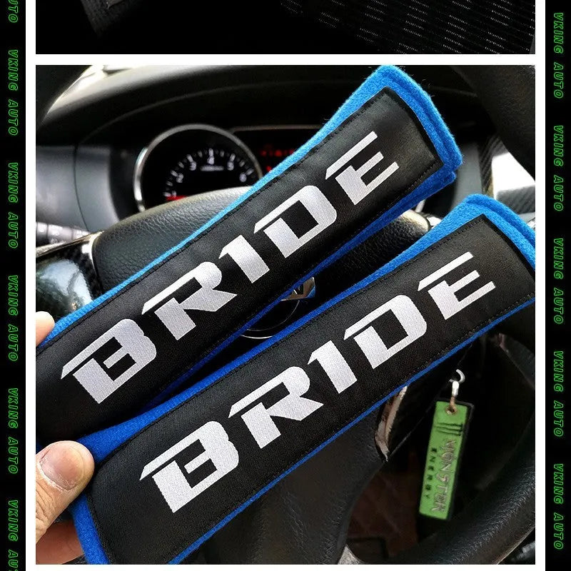 Black cotton sponge cloth car seat belt shoulder pad showing embroidery weaving texture and 22.5cm length
