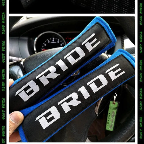 Black cotton sponge cloth car seat belt shoulder pad showing embroidery weaving texture and 22.5cm length