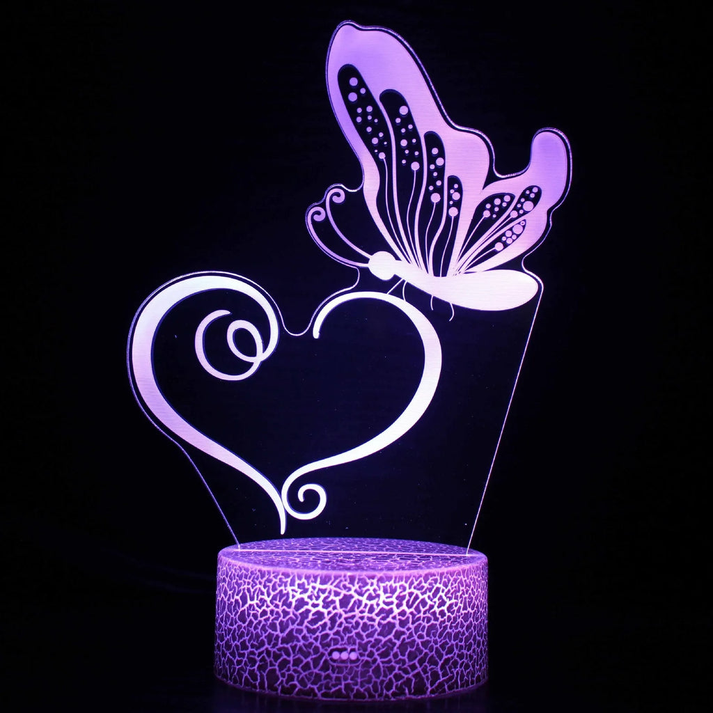 Colourful 3D acrylic USB table lamp with touch control on a wooden desk.