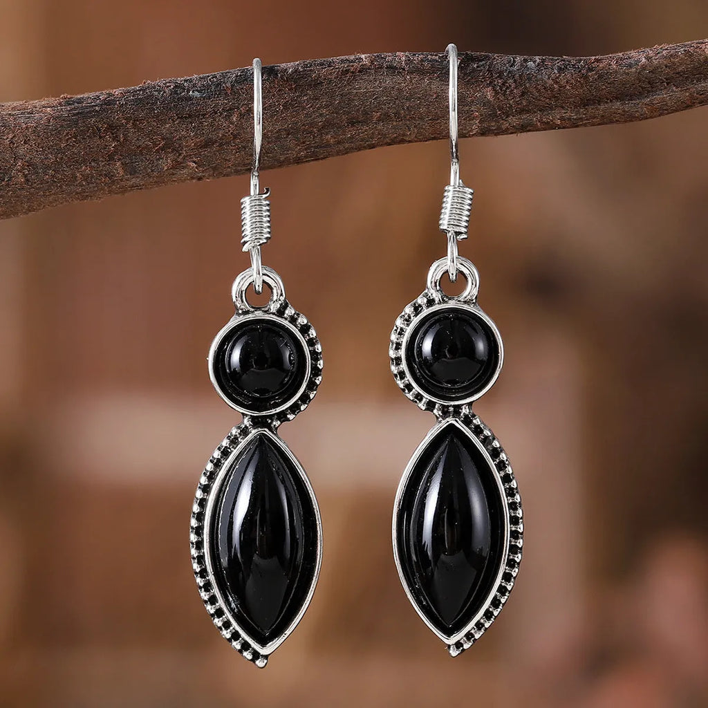 Vintage geometric zinc alloy earrings with electroplated black or purple colour and round pendant elements