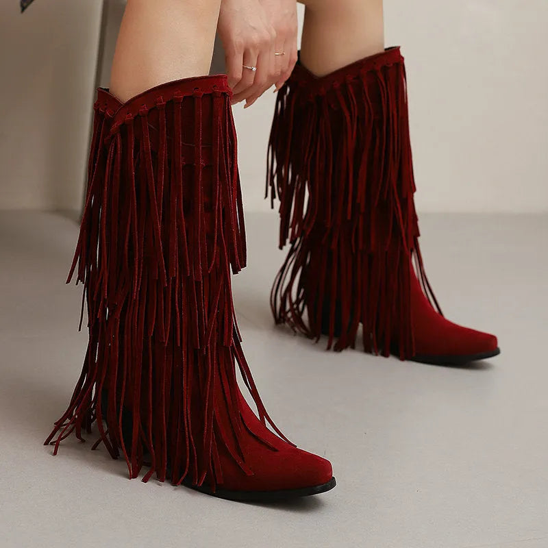 Women's beige suede knee-high boots with tassel, chunky heel, and square toe on a waterproof platform.