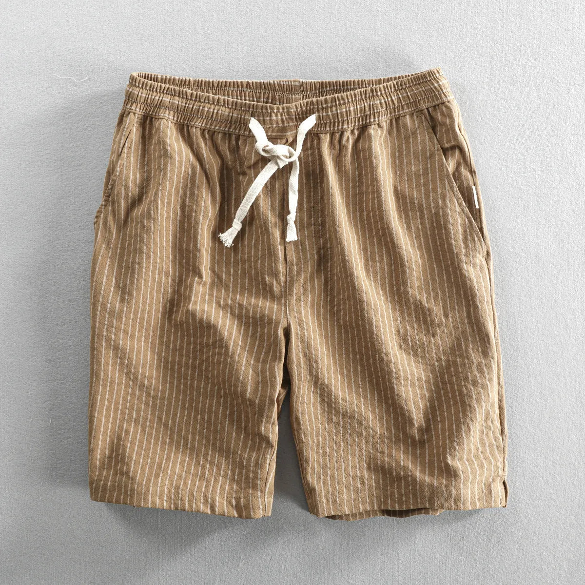 Men's striped casual cotton shorts with an elastic waistband shown in multiple colour options.