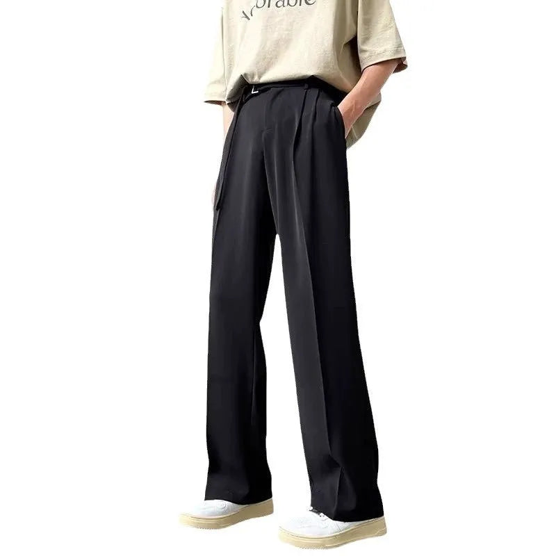 Black thin straight wide leg trousers on a hanger, showing loose fit and straight leg opening.