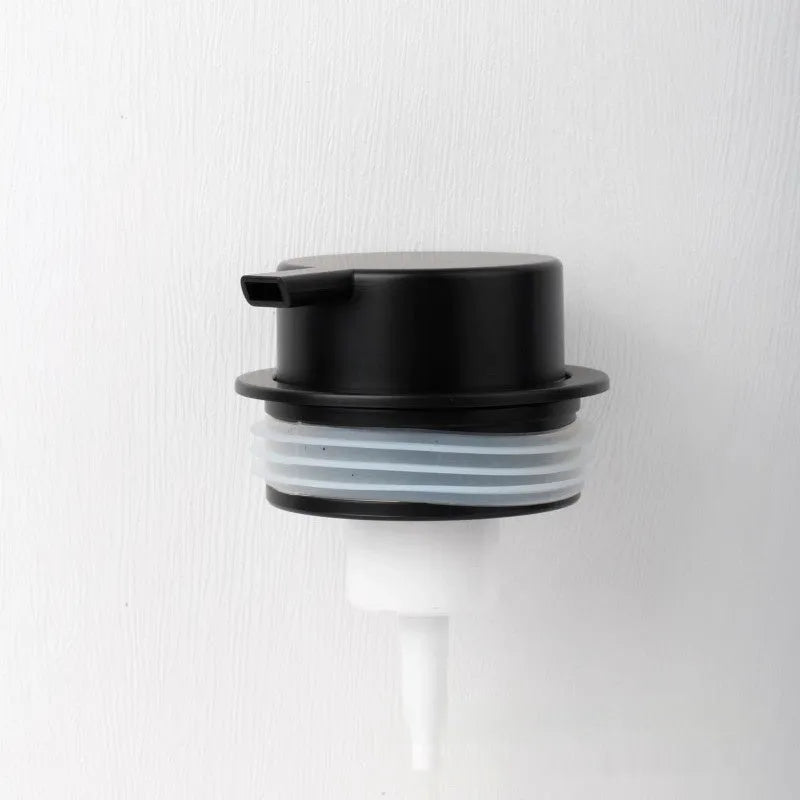 Foam pump facial cleanser dispenser with large plastic pump head in metallic finish