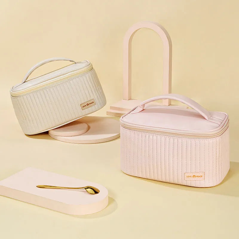 Open-top makeup bag in PU leather showing six colour options including pink, coffee, and light blue