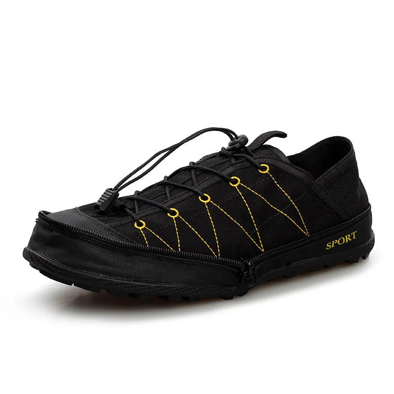 Orange portable folding outdoor hiking shoe with side zipper on a grey background.