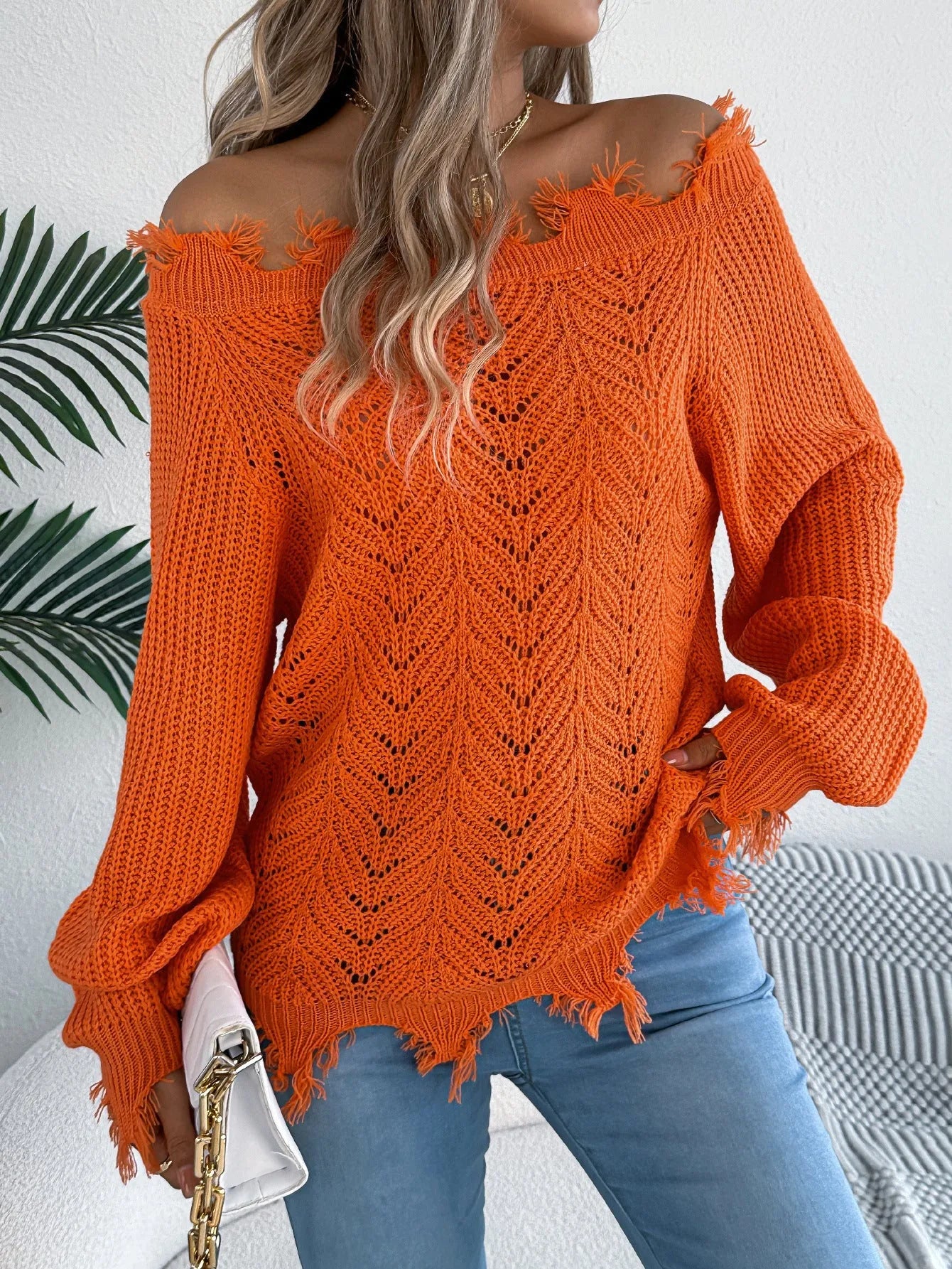 White hollow-out long-sleeved pullover sweater with cut off-the-shoulder design