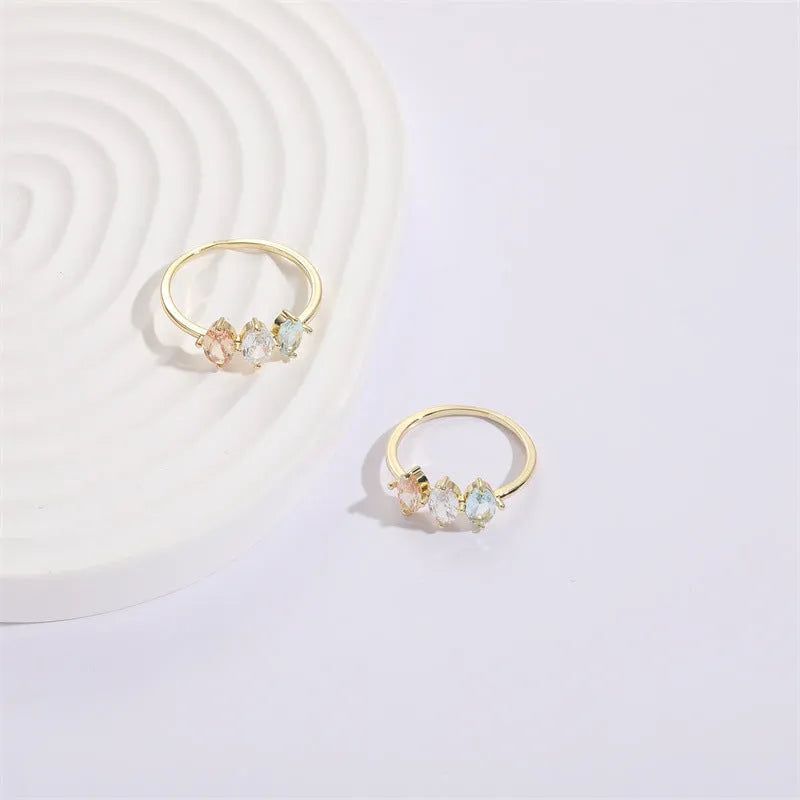 Geometric triangle birthstone ring with horse eye tricolor zircon stones in gold finish