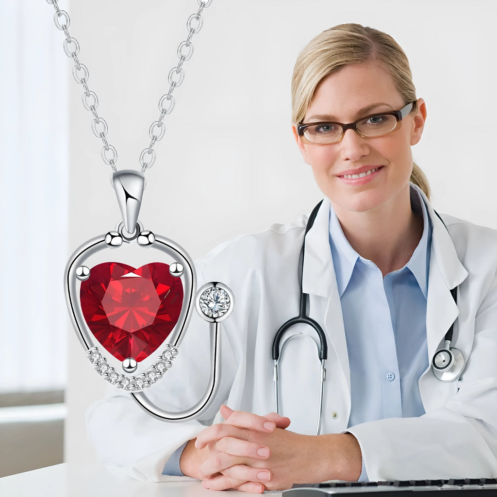 Women's fashion necklace with wings, cross and stethoscope design in red diamond colour on copper