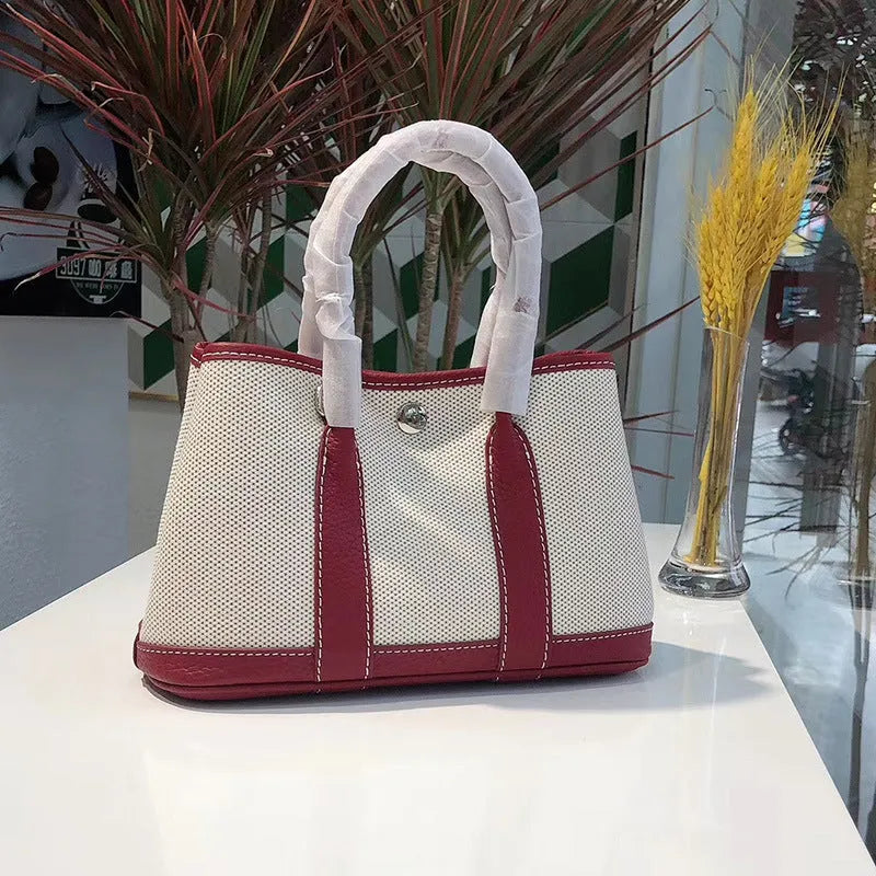 Genuine leather women's crossbody tote bag with canvas lining in bucket shape