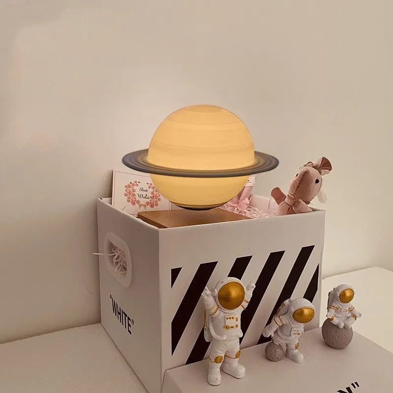 Maglev levitating planet night light floating above base with astronaut figurines