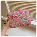 Women's floral print laptop bag in green flower pattern showing storage compartments
