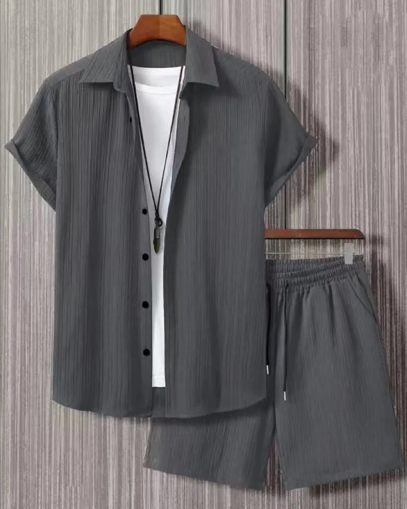Men's jacquard short sleeve suit set in black with matching shorts, showing front view