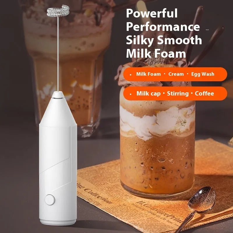 Black handheld electric milk frother with stainless steel whisk and USB charging port