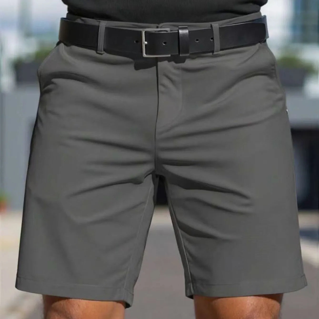 Men's solid colour straight-leg polyester shorts with micro elasticity, shown in apricot.