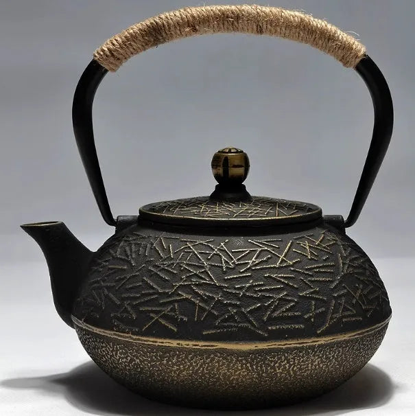 A cast iron teapot with Japanese-style hand-painted decoration, shown in a Bronze finish, with a capacity of 0.9 litres.