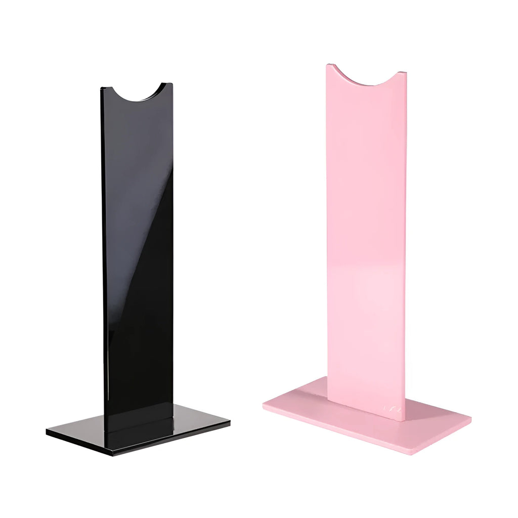 Pink and black detachable gaming headset bracket with silicone non-slip base on a desk