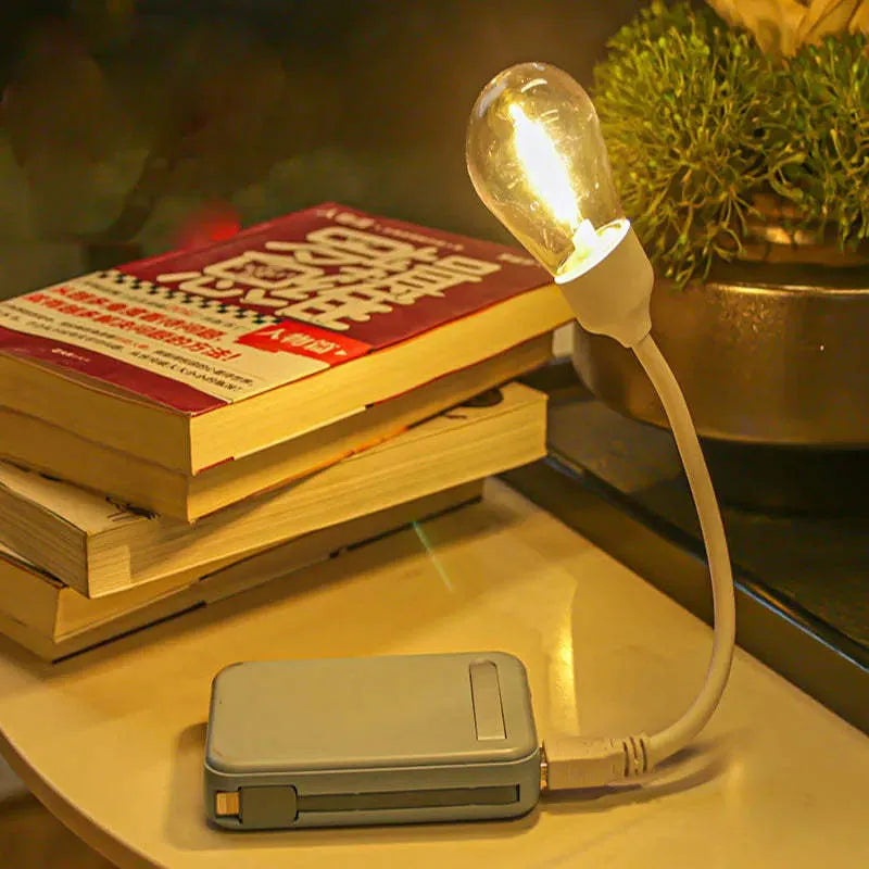 USB rechargeable folding night light with tungsten filament bulb in compact folded position