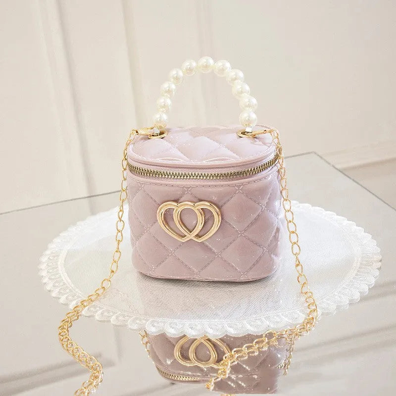PVC bucket-style gel bag for women with a heart pattern, shown in multiple colour options.