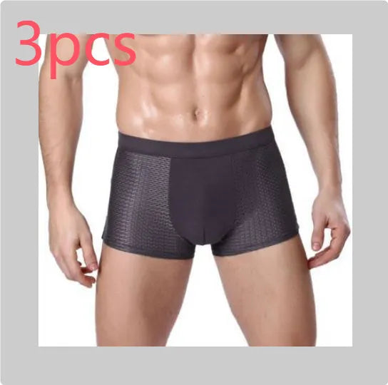 Men's solid colour modal boxer briefs with U convex design on a mannequin, showing mid-waist fit.