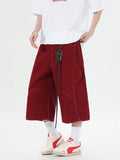 Retro denim workwear shorts with multiple pockets, wide leg cut and cropped trousers length