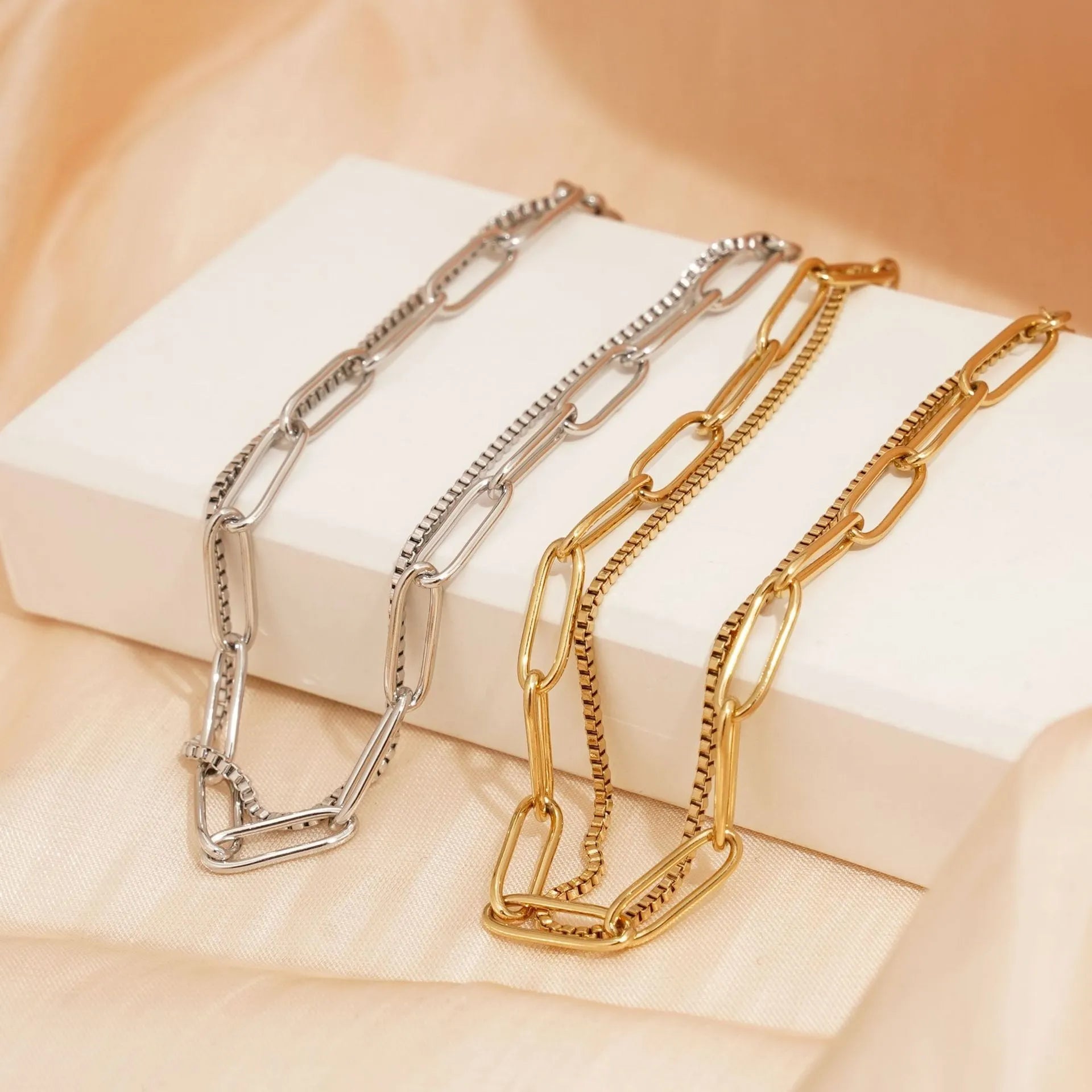 Women's double layer stainless steel bracelet with geometric design in gold or silver finish