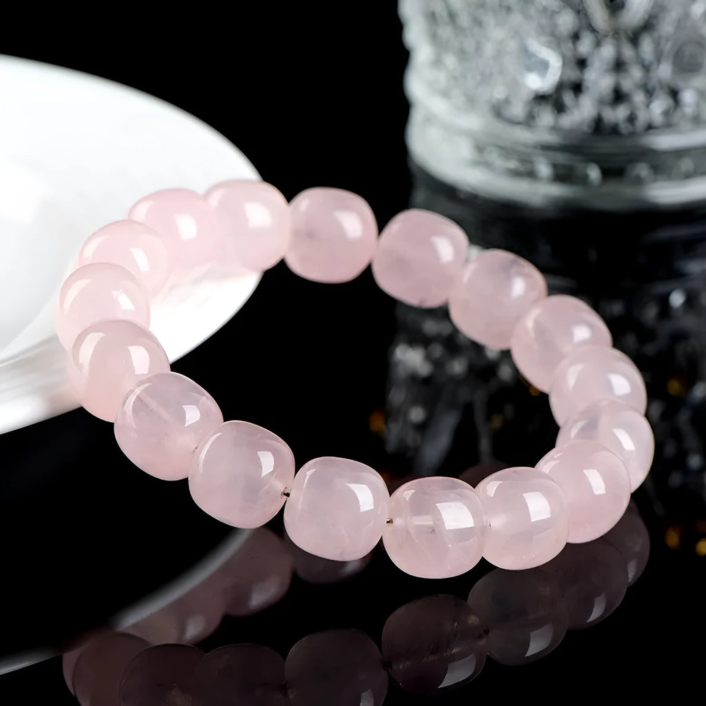 Pink bamboo crystal barrel bead bracelet with 11-12mm geometric beads on wrist