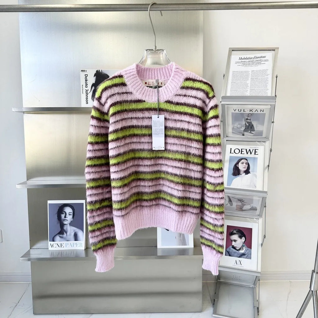 Pink wool lazy coat style cardigan sweater with contrast colour details on a hanger.