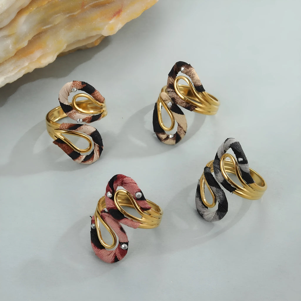 Leopard print stainless steel open mouth ring in heart, star, or geometric shape.