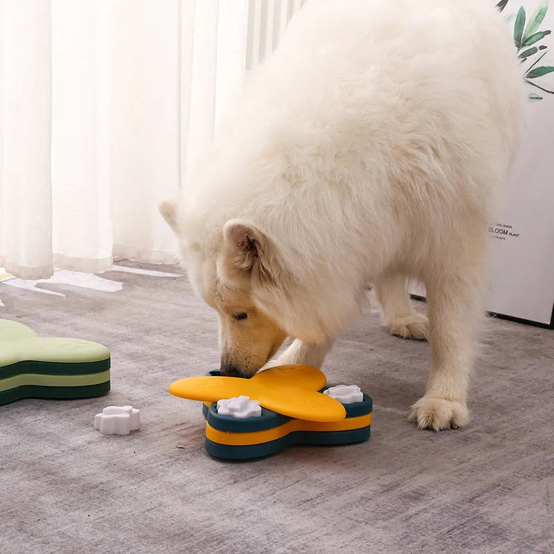 Green and yellow dog puzzle toy with nine bone-shaped covers on a non-slip base.