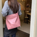 Corduroy one-shoulder commuter bag in pink or brown with PU lining, showing dimensions