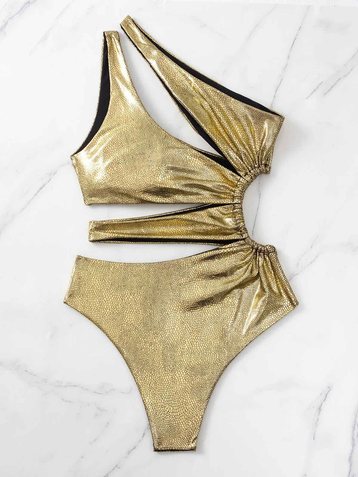 Gold backless one-piece swimsuit for women with spandex construction in S, M, L sizes