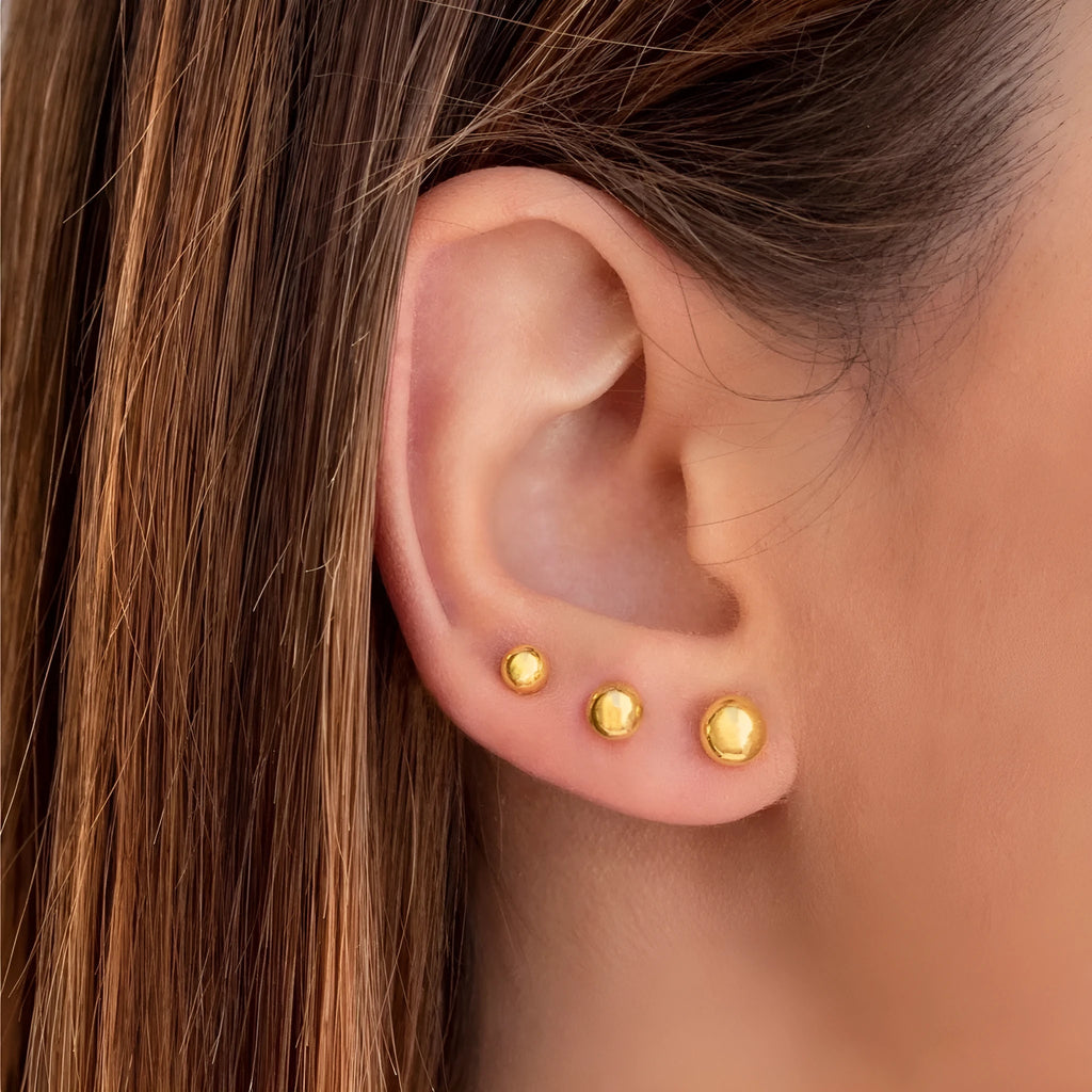 Minimalist stainless steel ball stud earrings in gold and silver tones, showing 3mm 4mm 5mm 6mm size difference.