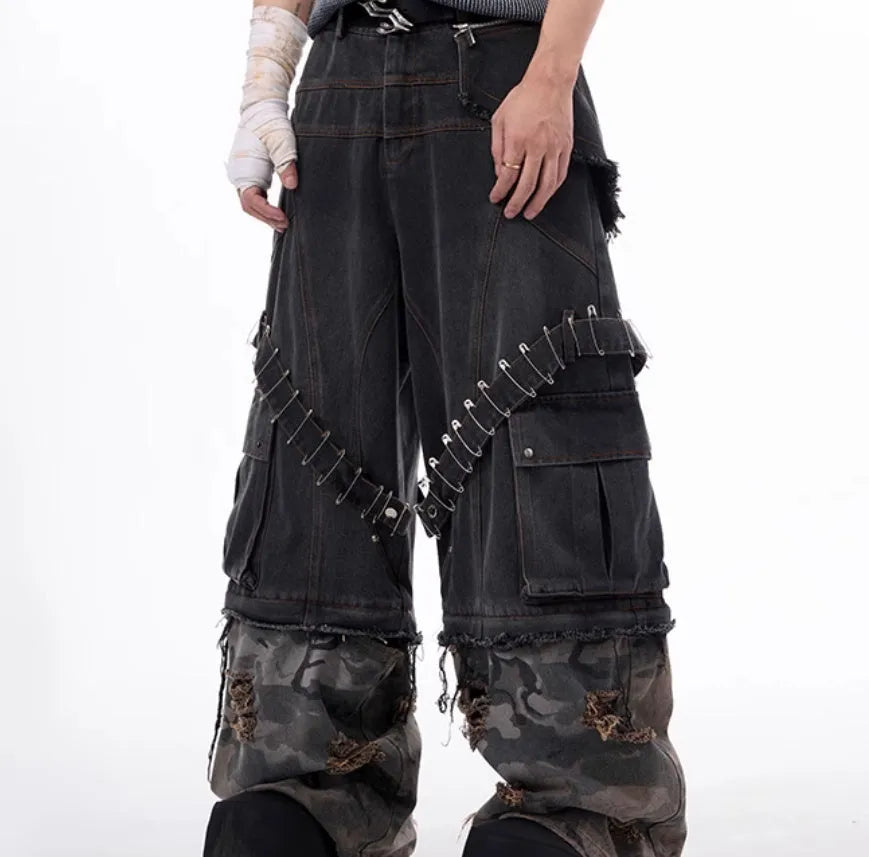 Grey men's camouflage print jeans with structural splicing and ribbon detailing on cotton denim.