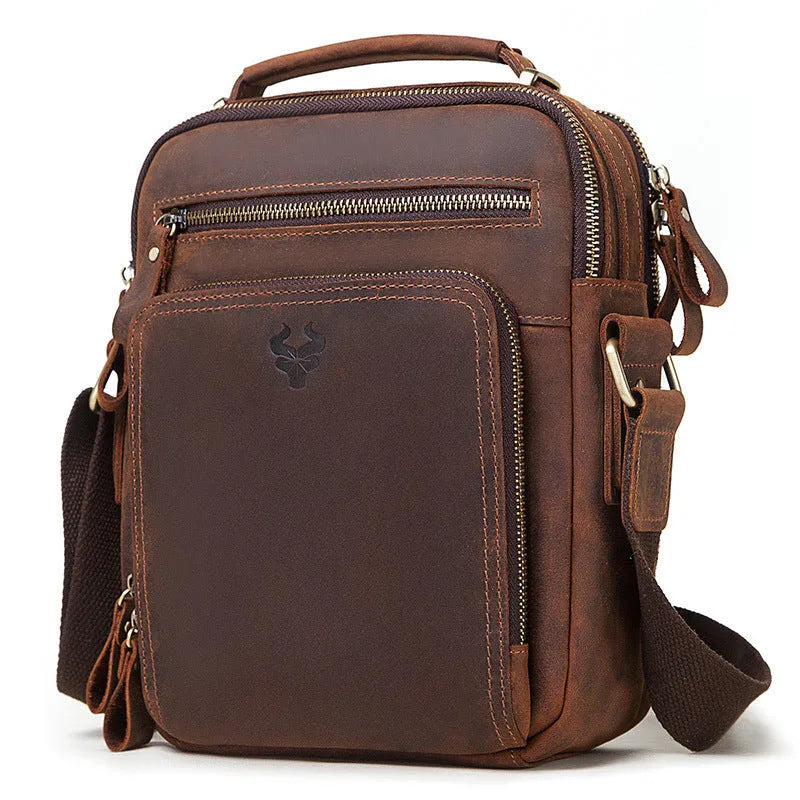 Men's brown Crazy Horse leather crossbody bag with sewing line details and crossbody strap