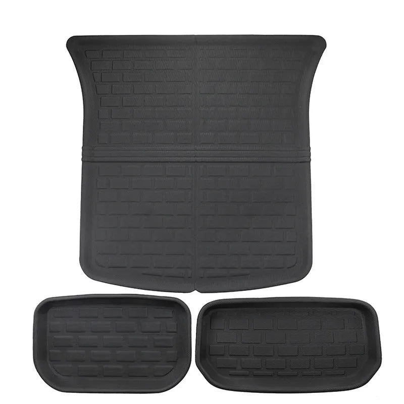 TPR floor mat set for Tesla Model Y showing footwell, storage box, and tailbox mats.