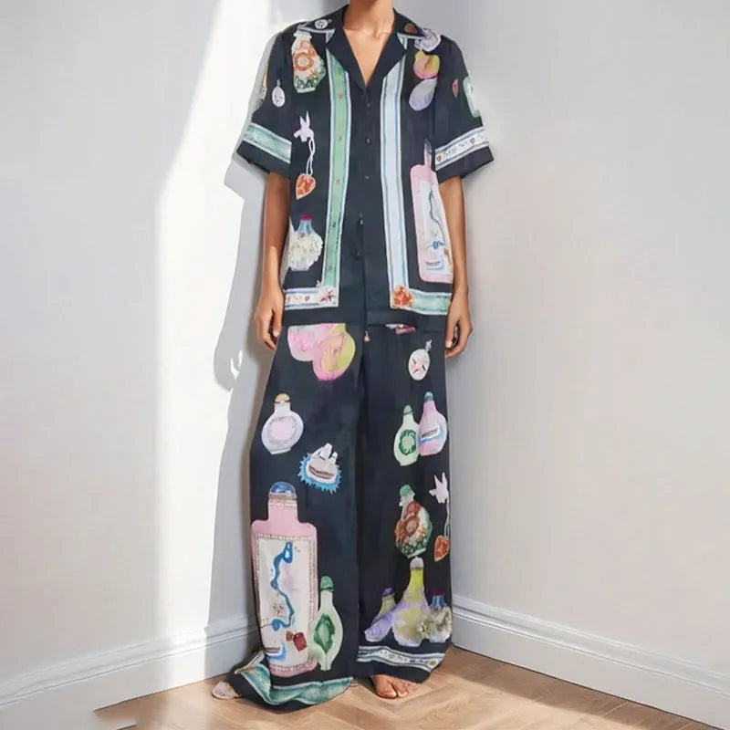 Black women's cartoon print casual set with cardigan and matching trousers
