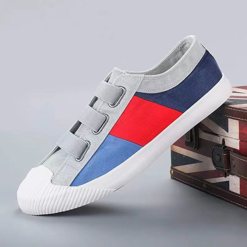 Men's beige canvas low-top sneakers with elastic band closure and a flat rubber sole