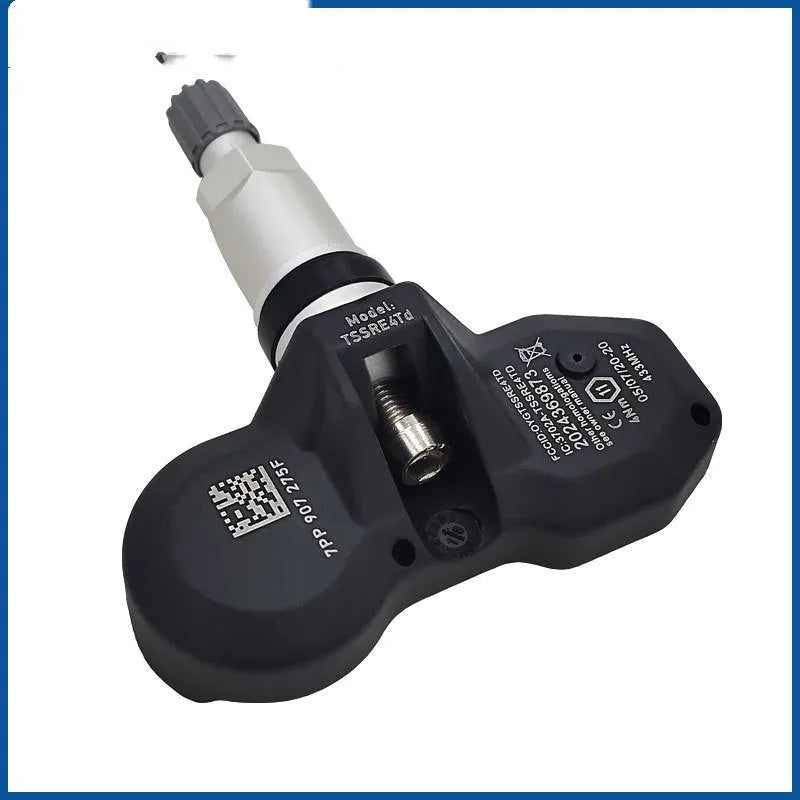 Black tyre pressure monitoring sensor for Audi vehicles on white background