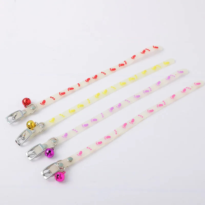 Glow in the dark cat collar with adjustable silicone chain and metal bell in paw print design